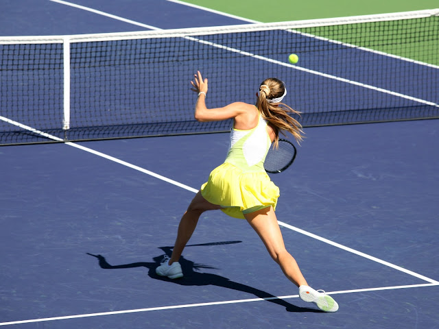 Tennis player hitting a tennis ball